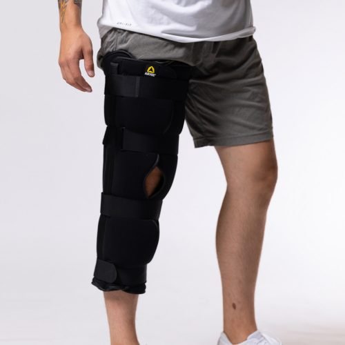 A man wearing a DELTALOCK+ KNEE brace from ARTIK Medical Supply.