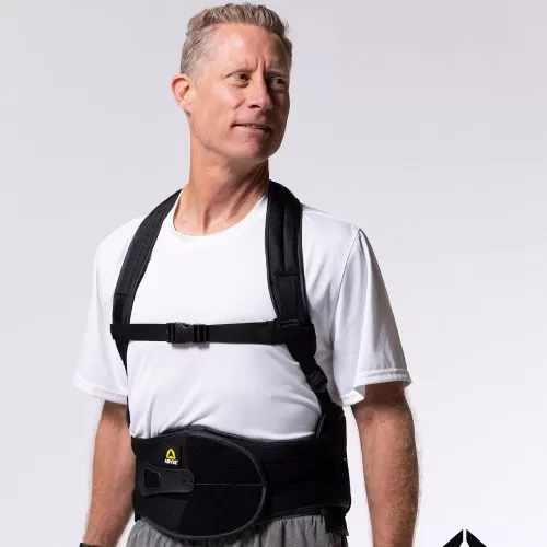 A man wearing a METFORCE® TLSO standing in front of a white background.